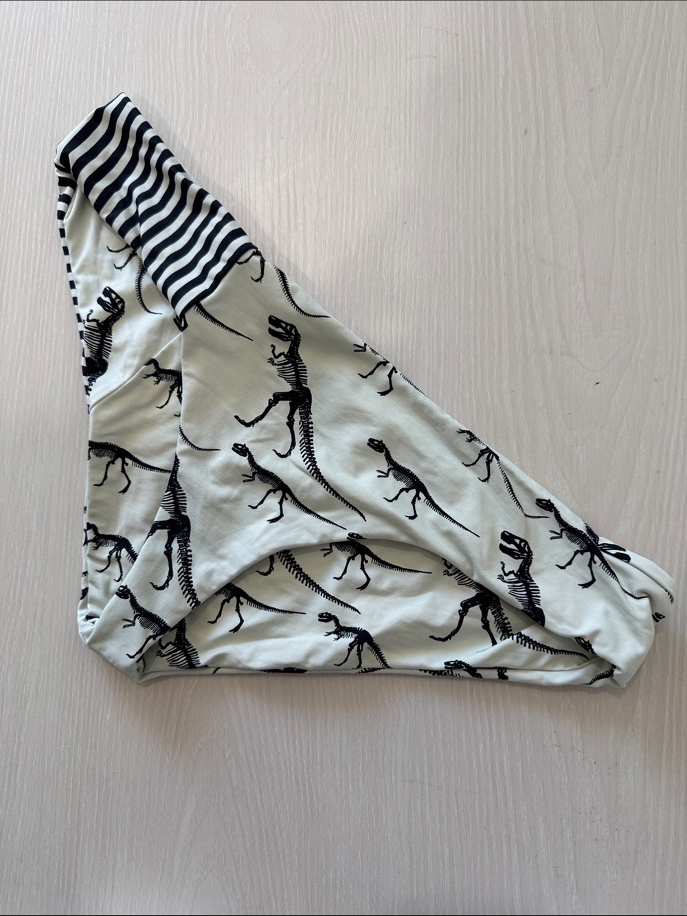 Boys + Arrows Primal Reversible Black Dinosaur Print Bikini Bottoms on Cream